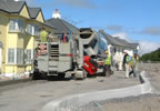 Kerbing machine laying road kerbing for new housing estate